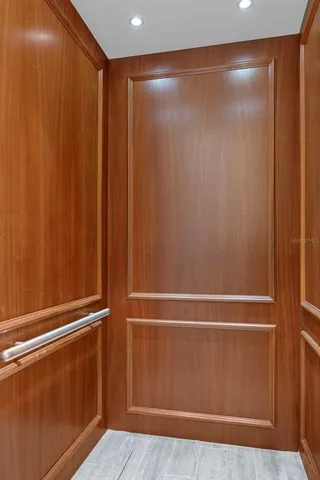 a living room with furniture a rug and a fireplace