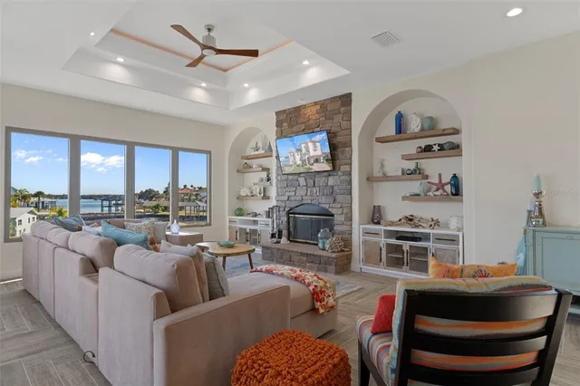 a view of a balcony with chairs and iron gate