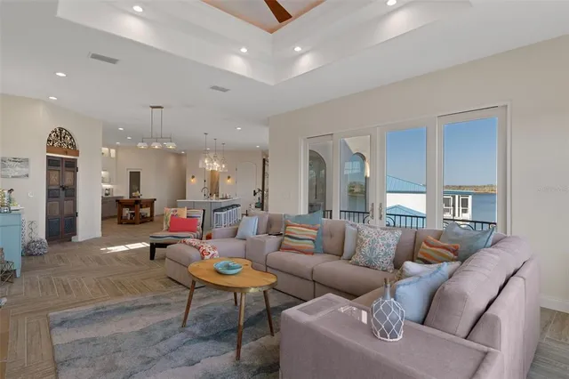 a terrace with chairs and wooden floor