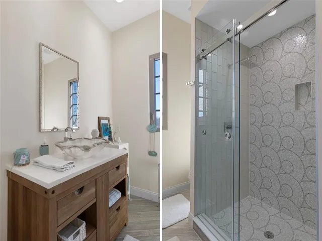 a bedroom with a bed and a night stand