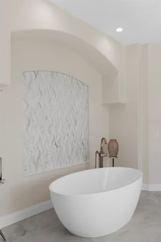 a living room with furniture and palm tree