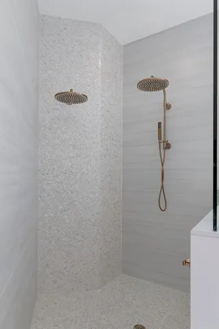 a living room with a fireplace and a floor to ceiling window