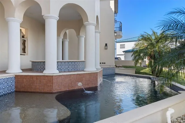 a view of a swimming pool with a patio