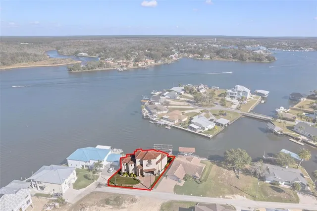 a view of a room with furniture and wooden floor