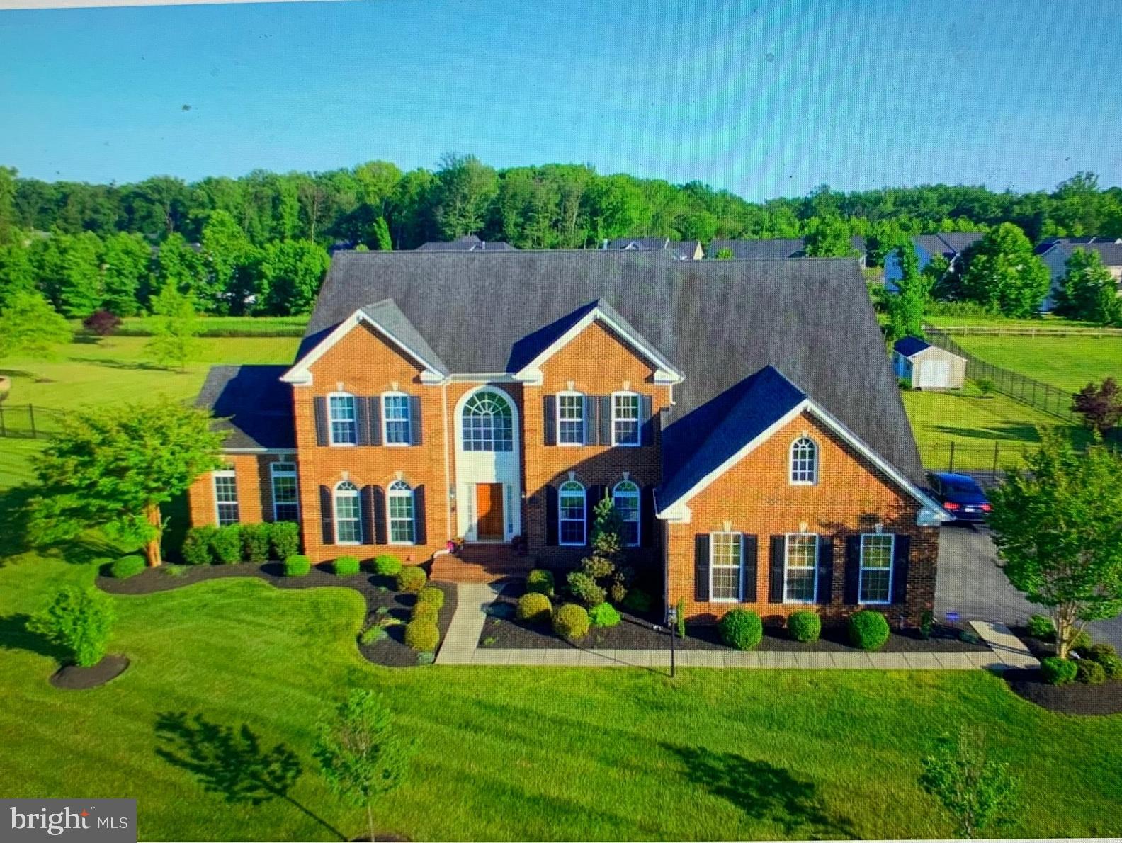 14205 Derby Ridge Road Bowie, MD 20721 - Photo 1 of 53 a view of a yard in front of house