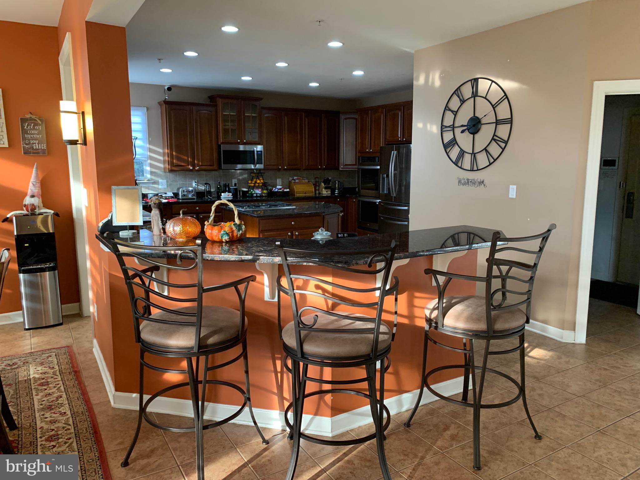 14205 Derby Ridge Road Bowie, MD 20721 - Photo 11 of 53 a dining room filled chandelier and wooden floor