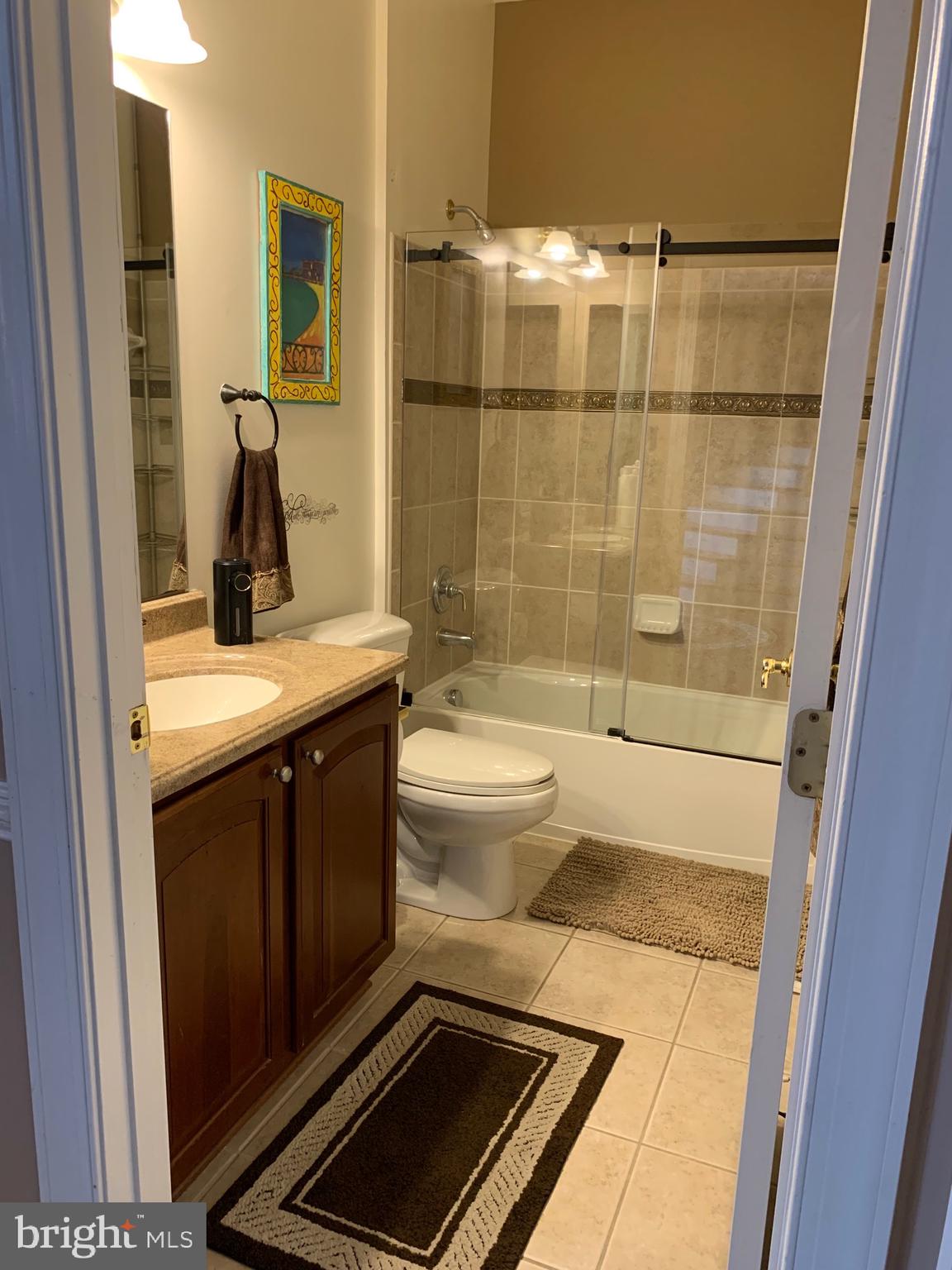 14205 Derby Ridge Road Bowie, MD 20721 - Photo 20 of 53 a bathroom with a sink a toilet and shower