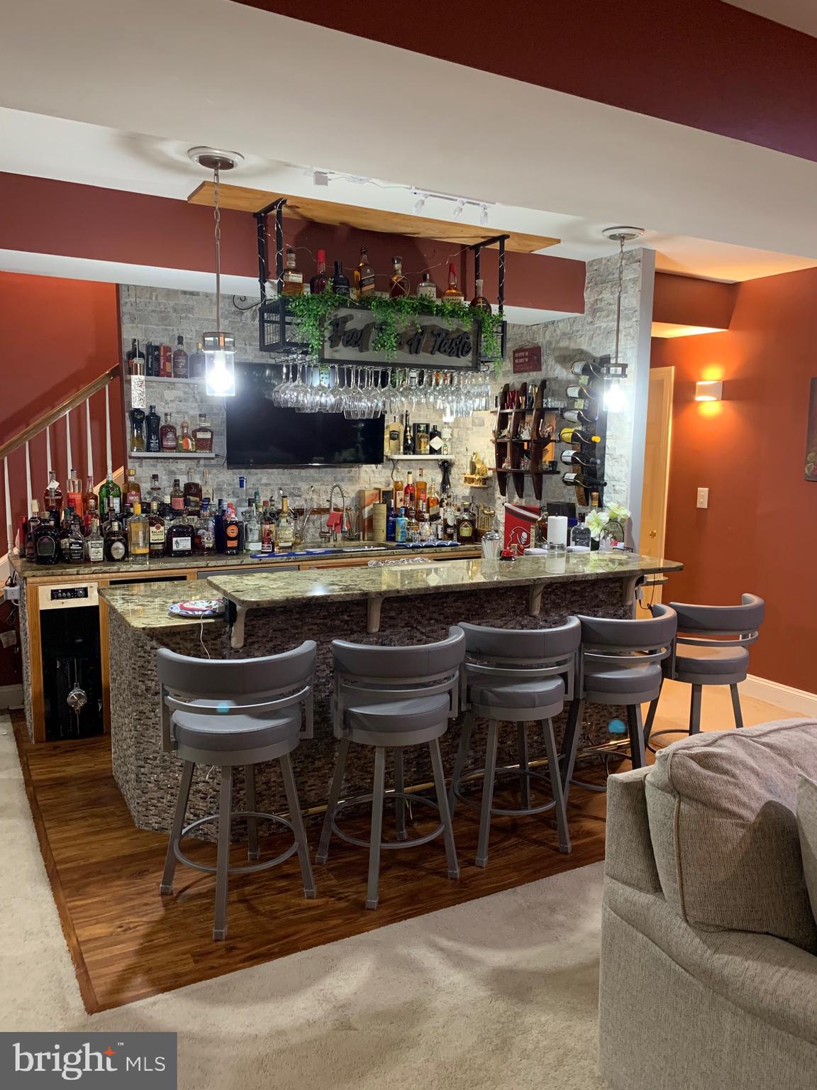 14205 Derby Ridge Road Bowie, MD 20721 - Photo 29 of 53 a kitchen with a dining table chairs and white cabinets