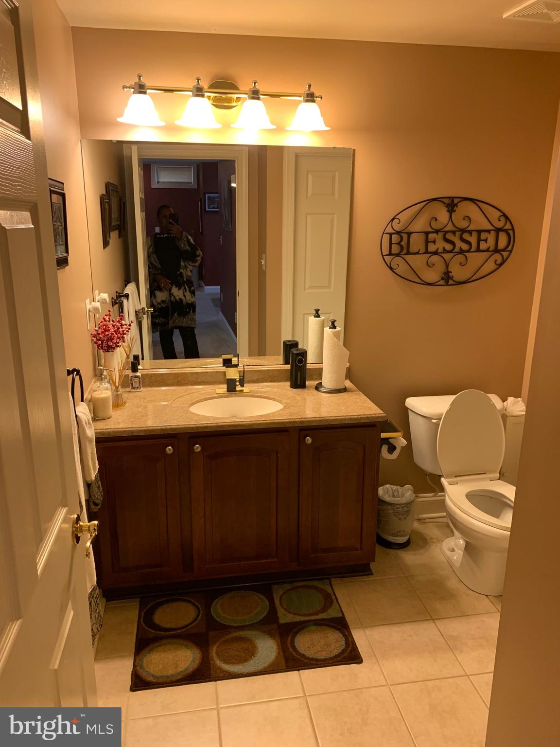 14205 Derby Ridge Road Bowie, MD 20721 - Photo 33 of 53 a bathroom with a sink a toilet and mirror