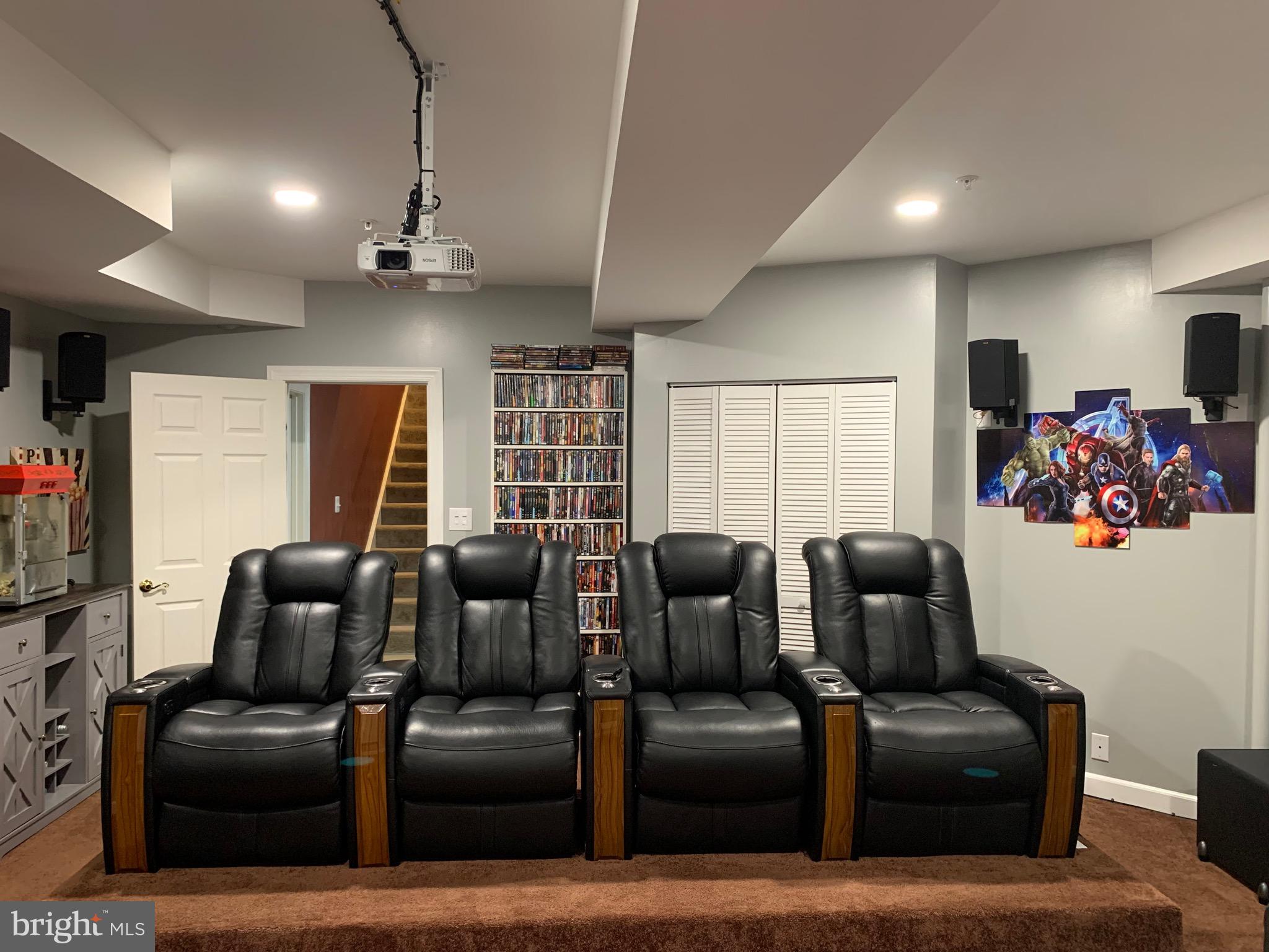 14205 Derby Ridge Road Bowie, MD 20721 - Photo 35 of 53 a media room with lots of chairs and wooden floor