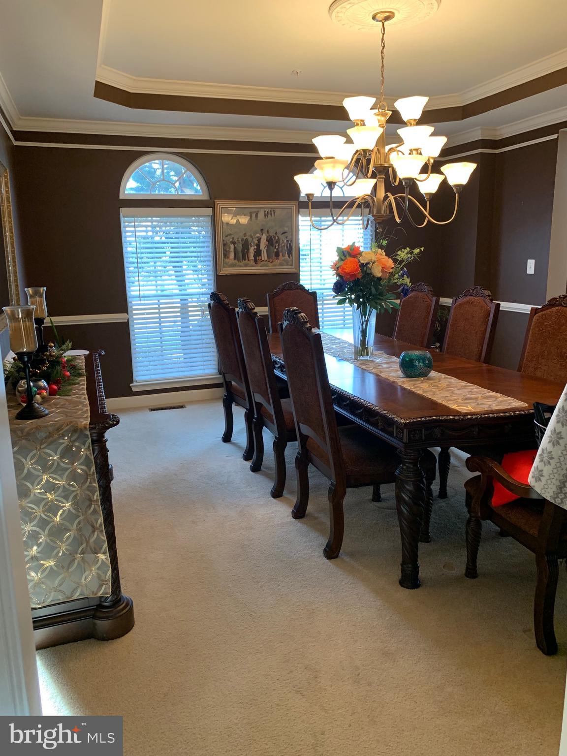 14205 Derby Ridge Road Bowie, MD 20721 - Photo 4 of 53 a view of a dining room with furniture and a chandelier