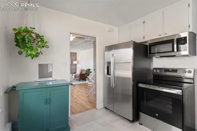 a room with cabinets and a window