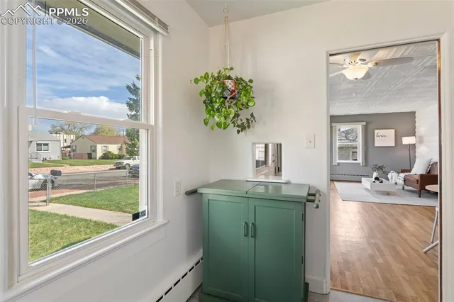 a kitchen with granite countertop a sink and cabinets