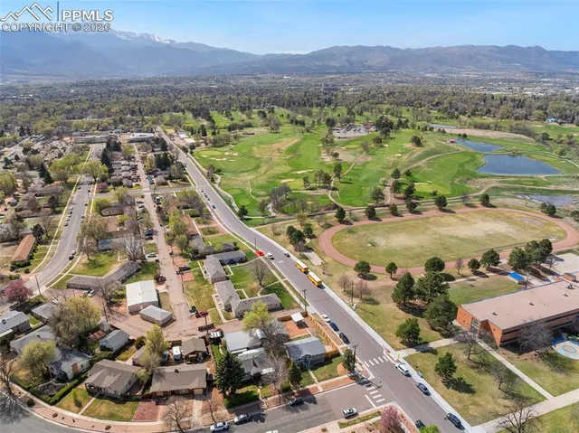 an aerial view of residential houses with outdoor space