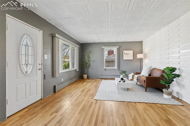 a living room with furniture and a window