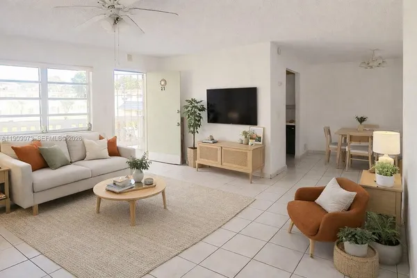 a living room with furniture and a flat screen tv