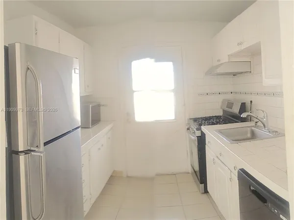 a bathroom with a toilet a sink and a shower