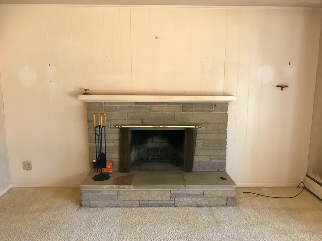 a living room with a fireplace
