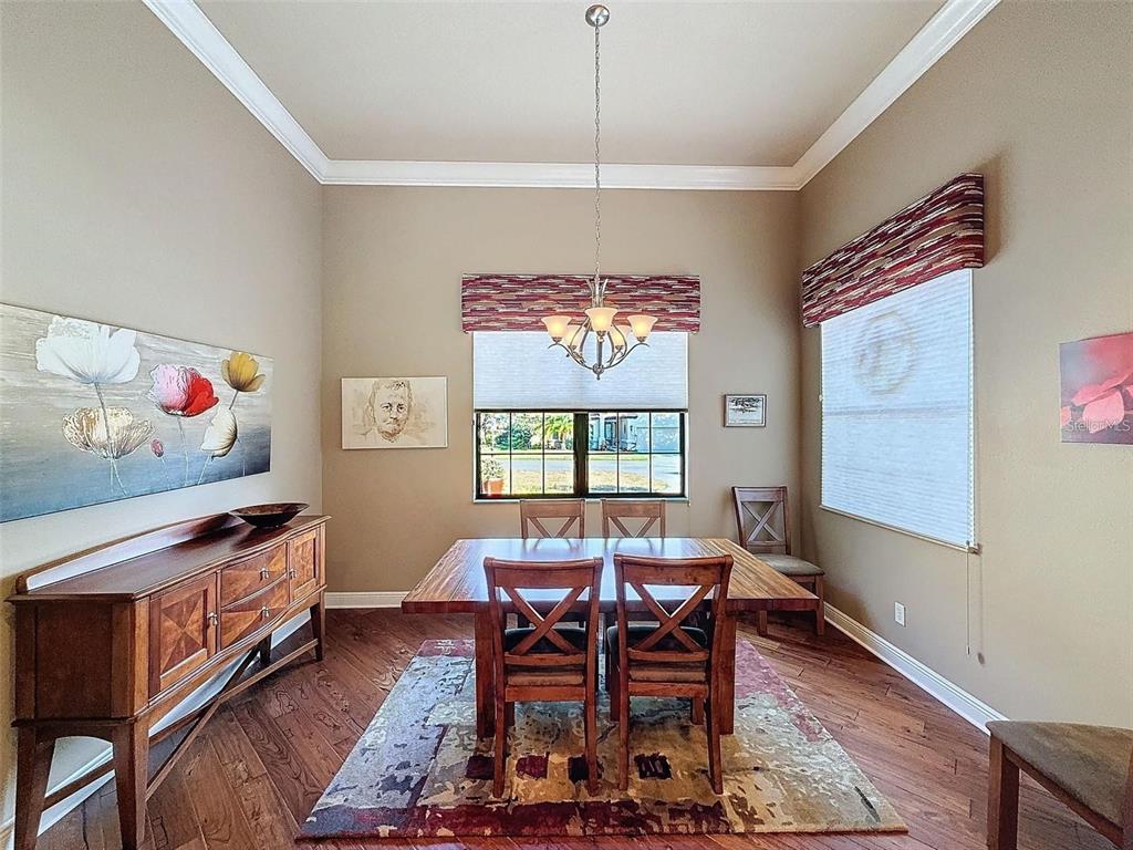1542 North Ridge Meadow Path Hernando, FL 34442 - Photo 13 of 38 a view of a dining room with furniture window and wooden floor