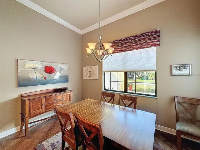 a bedroom with a large bed and a tv