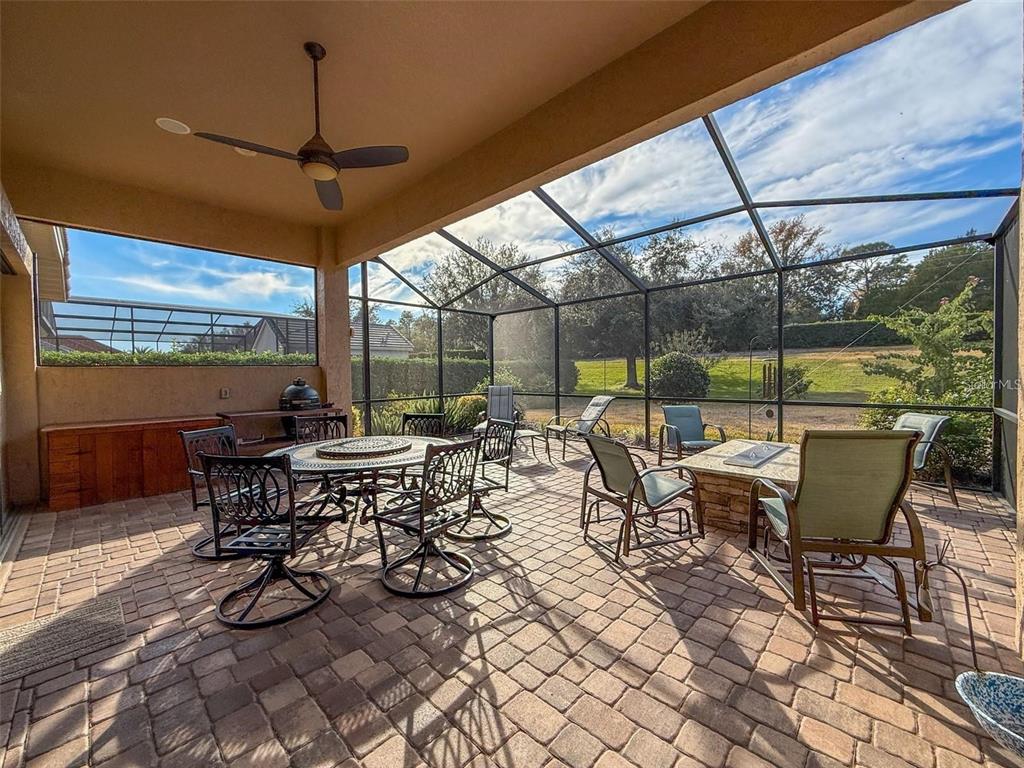 1542 North Ridge Meadow Path Hernando, FL 34442 - Photo 2 of 38 a view of a patio with a dining table and chairs