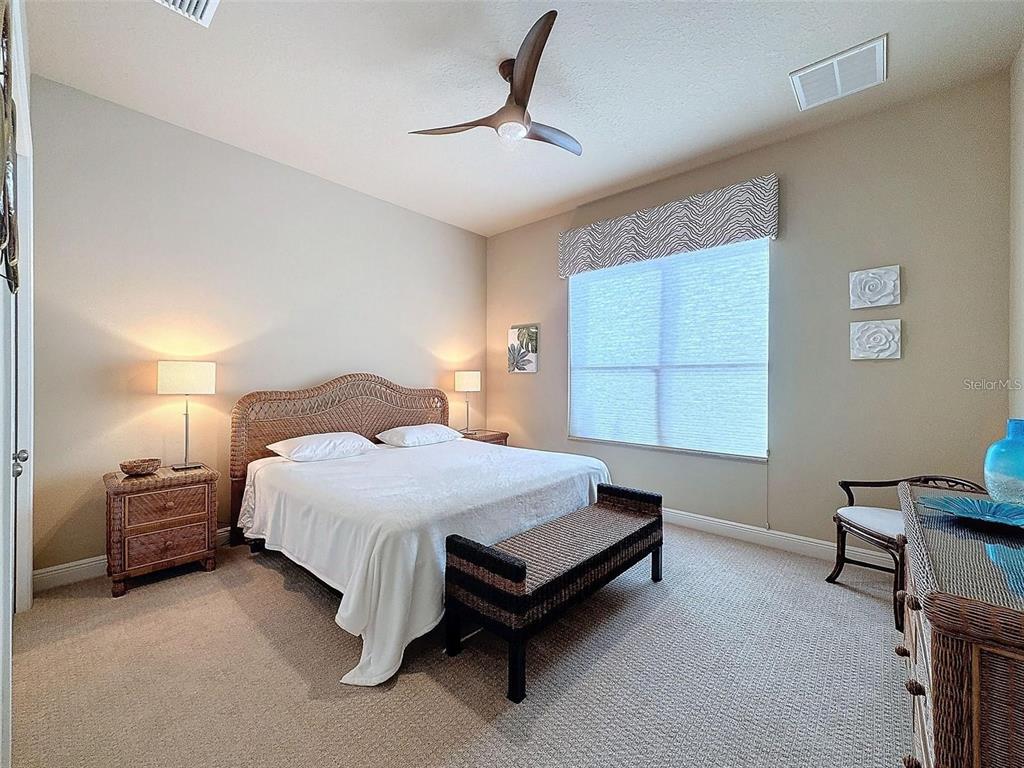 1542 North Ridge Meadow Path Hernando, FL 34442 - Photo 24 of 38 a spacious bedroom with a bed and a window