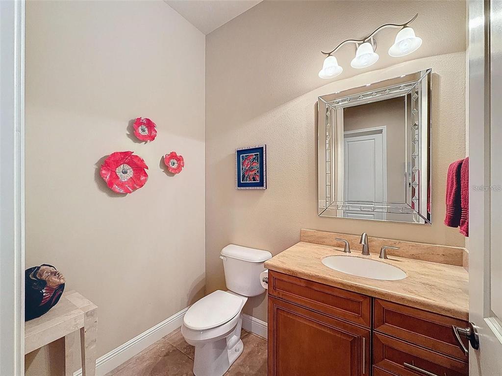 1542 North Ridge Meadow Path Hernando, FL 34442 - Photo 25 of 38 a bathroom with a sink vanity mirror and toilet