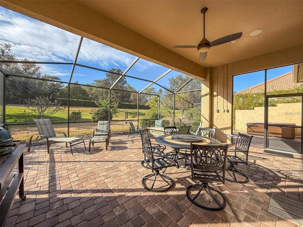 1542 North Ridge Meadow Path Hernando, FL 34442 - Photo 31 of 38 a view of a dining room with furniture wooden floor and a rug
