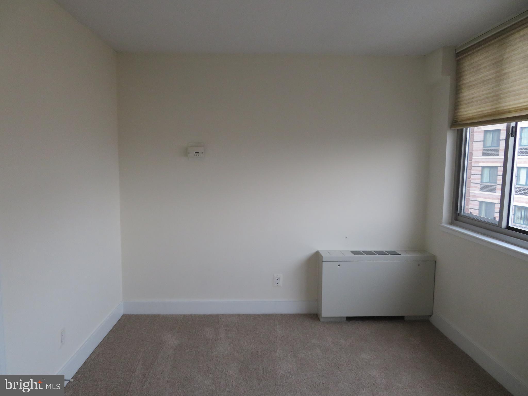 1220 Blair Mill Road, Unit 809 Silver Spring, MD 20910 - Photo 12 of 66 a view of an empty room with a window