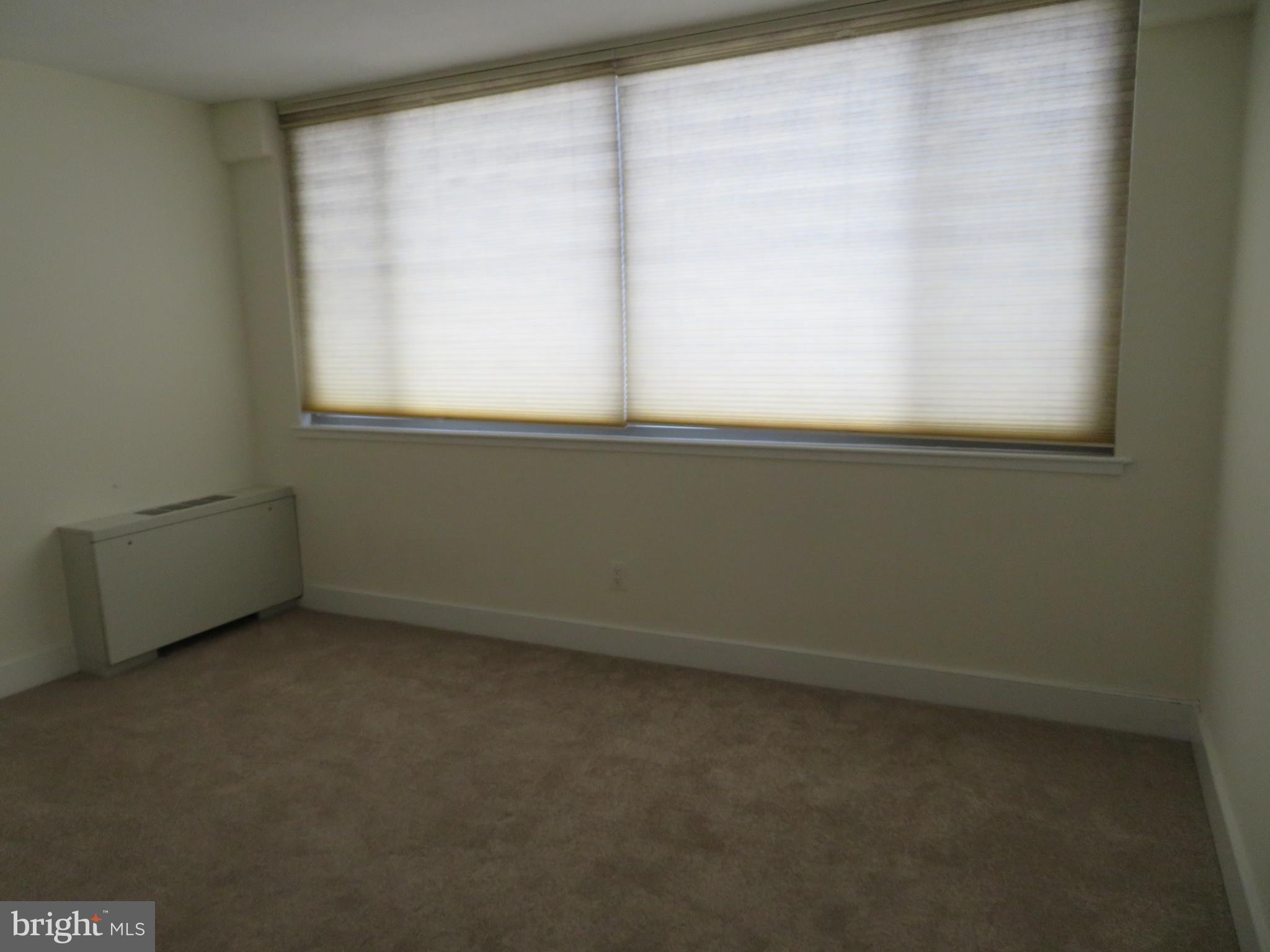 1220 Blair Mill Road, Unit 809 Silver Spring, MD 20910 - Photo 15 of 66 a view of an empty room with a window