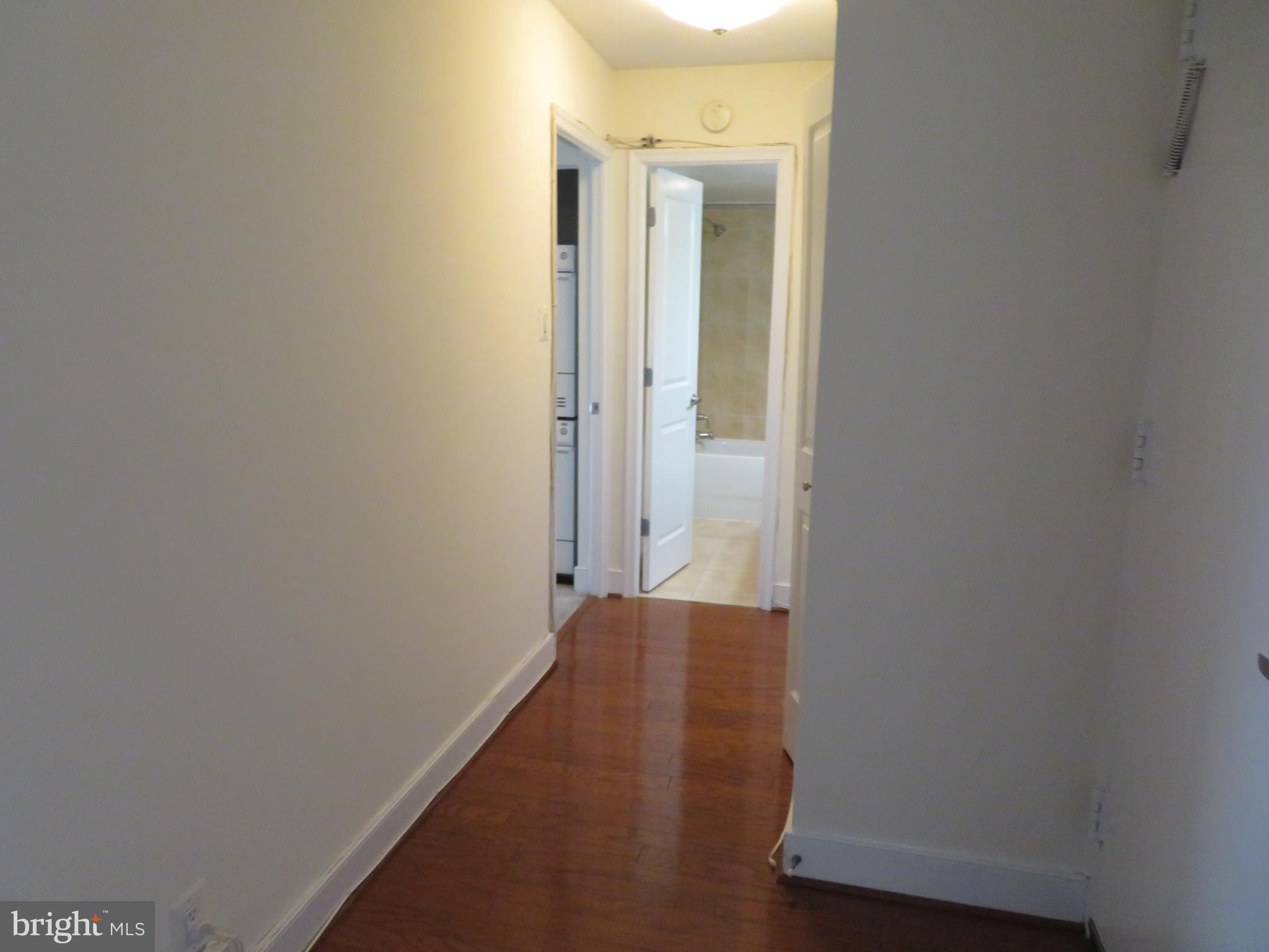 1220 Blair Mill Road, Unit 809 Silver Spring, MD 20910 - Photo 16 of 66 a view of a hallway with wooden floor