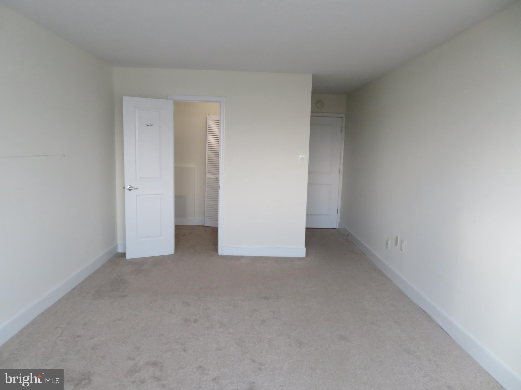 1220 Blair Mill Road, Unit 809 Silver Spring, MD 20910 - Photo 20 of 66 a view of an empty room and chandelier fan
