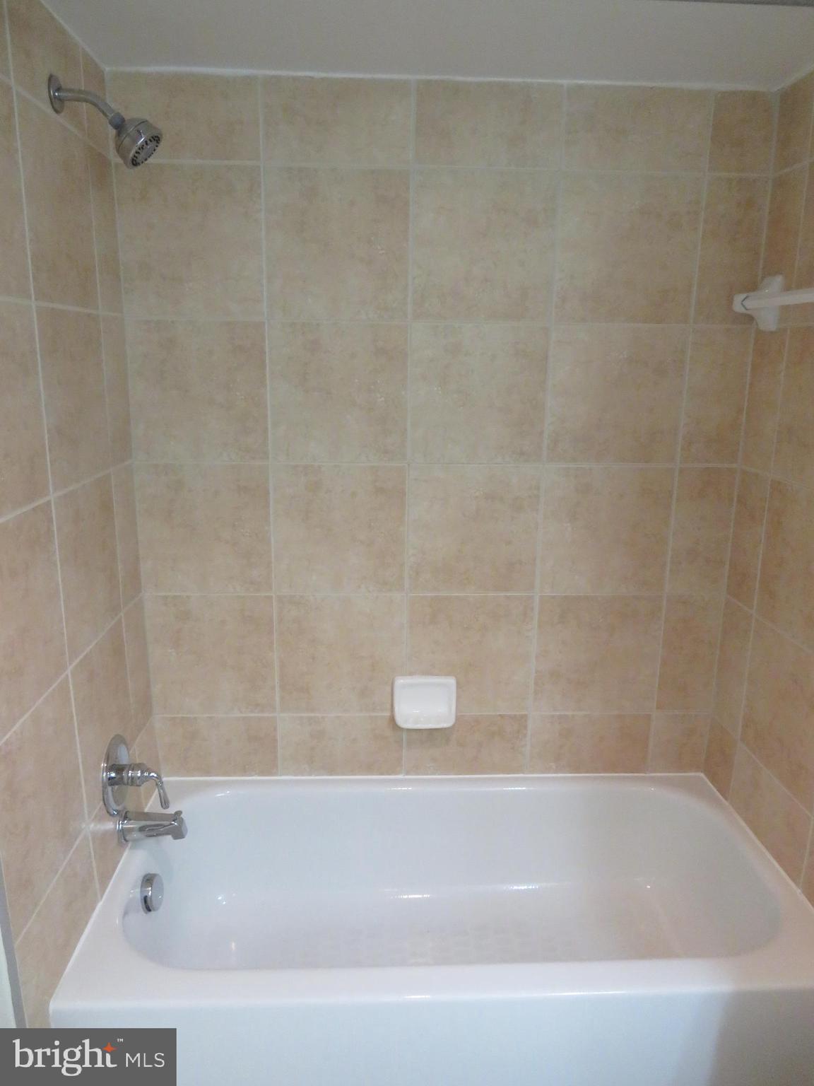 1220 Blair Mill Road, Unit 809 Silver Spring, MD 20910 - Photo 25 of 66 a bathroom with a shower and a bath tub