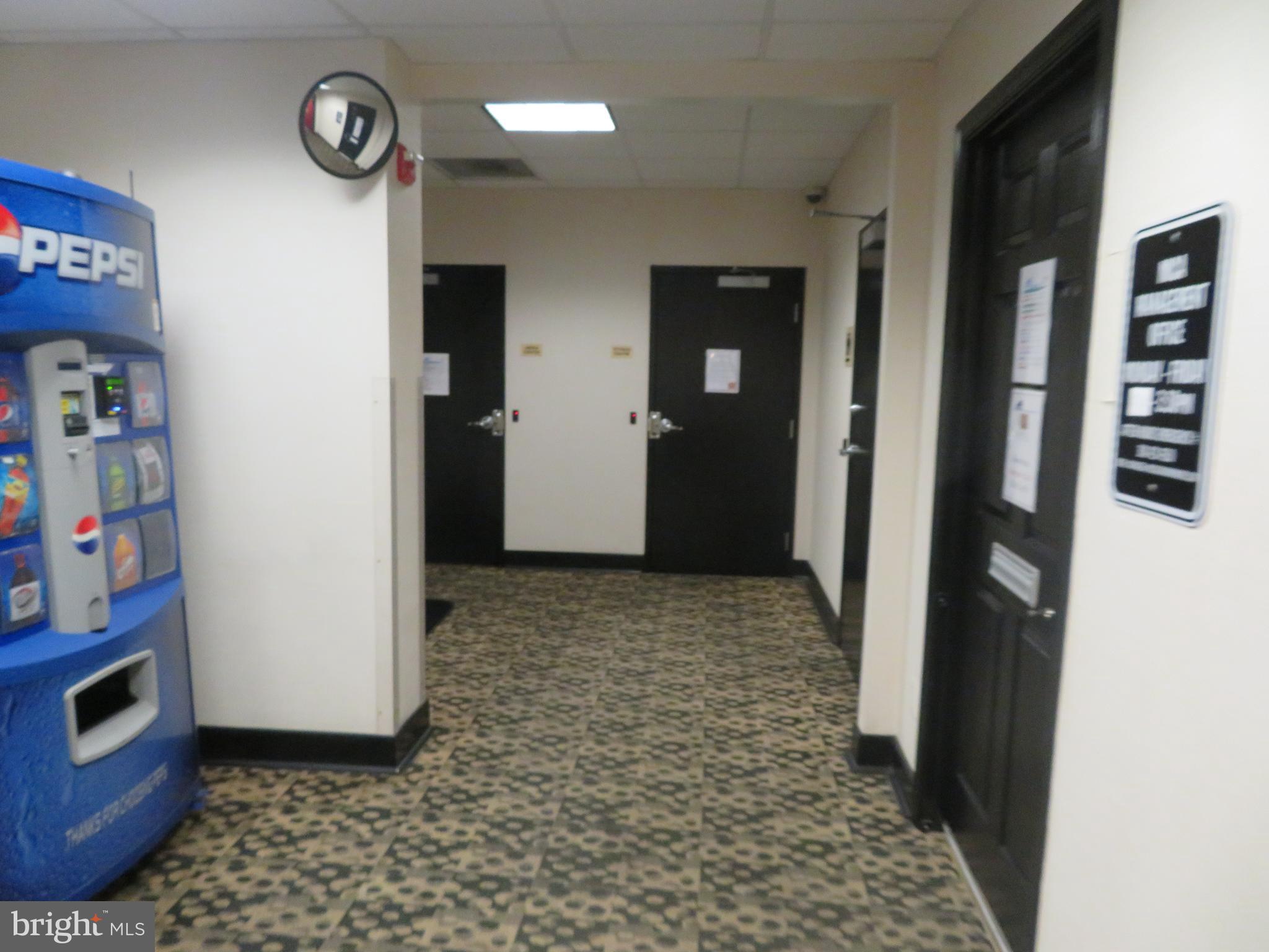 1220 Blair Mill Road, Unit 809 Silver Spring, MD 20910 - Photo 43 of 66 a view of a hallway with entryway and a window