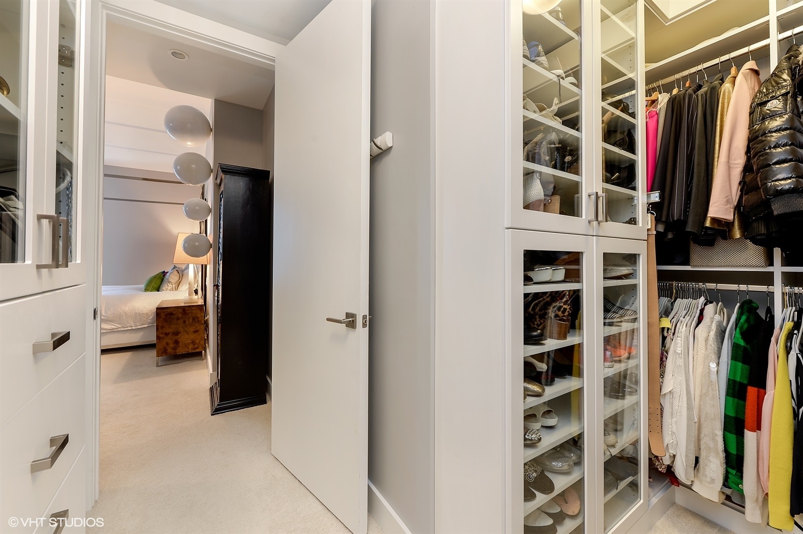 367 West Locust Street, Unit 606 Chicago, IL 60610 - Photo 14 of 24 a view of walk in closet with clothes and shoes