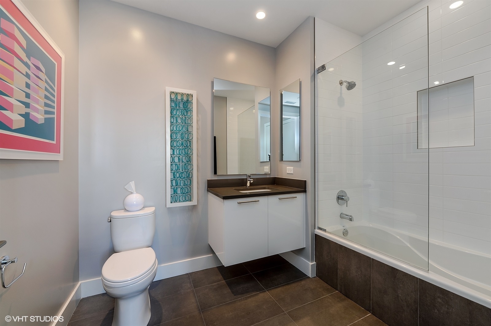 367 West Locust Street, Unit 606 Chicago, IL 60610 - Photo 17 of 24 a bathroom with a granite countertop toilet sink and mirror