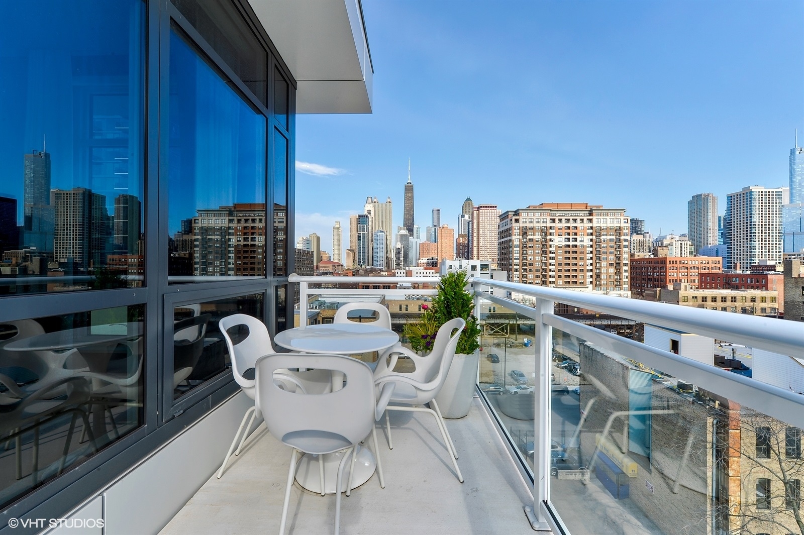 367 West Locust Street, Unit 606 Chicago, IL 60610 - Photo 19 of 24 a view of a balcony with chairs
