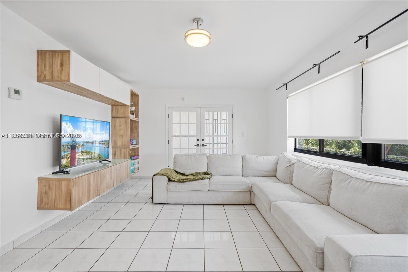 6418 Southwest 39th Terrace Miami, FL 33155 - Photo 11 of 24 a living room with furniture and white walls