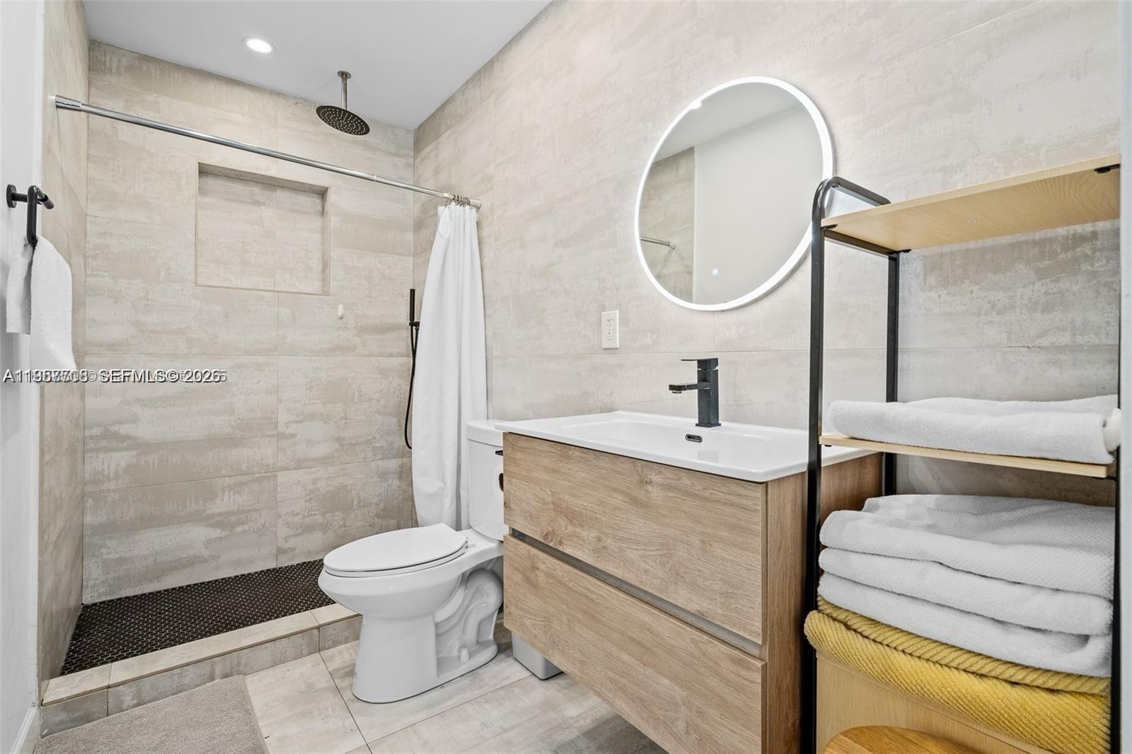 6418 Southwest 39th Terrace Miami, FL 33155 - Photo 19 of 24 a bathroom with a sink toilet and shower