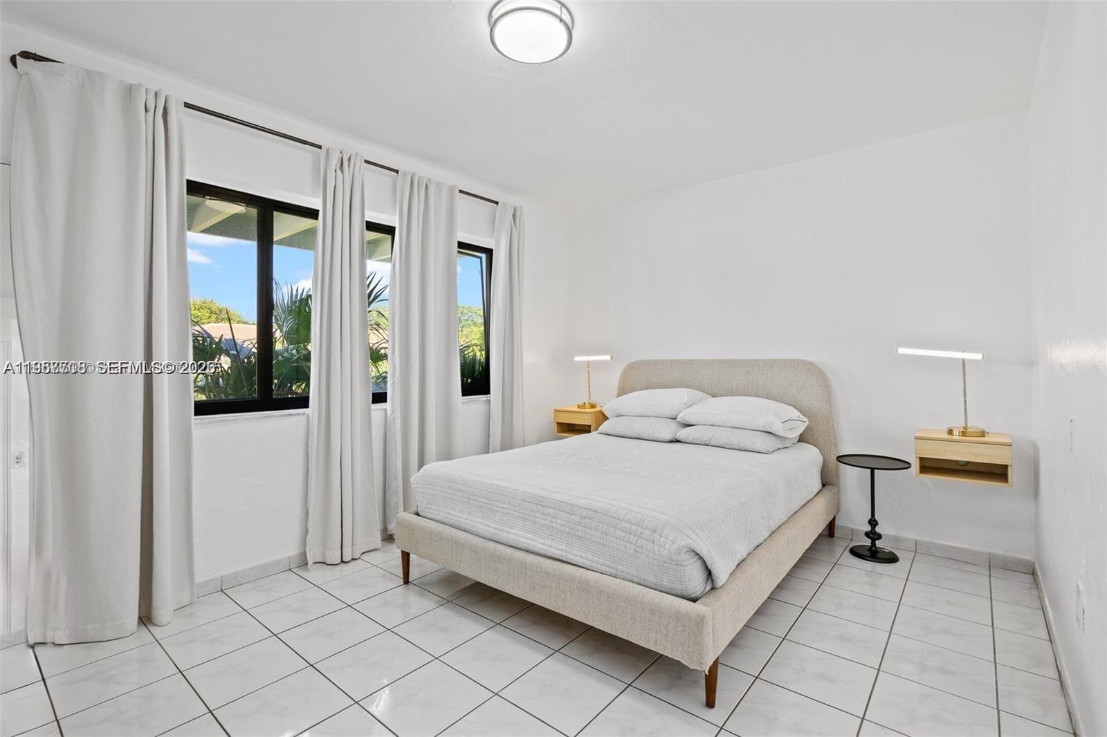 6418 Southwest 39th Terrace Miami, FL 33155 - Photo 20 of 24 a bedroom with a bed and a shower