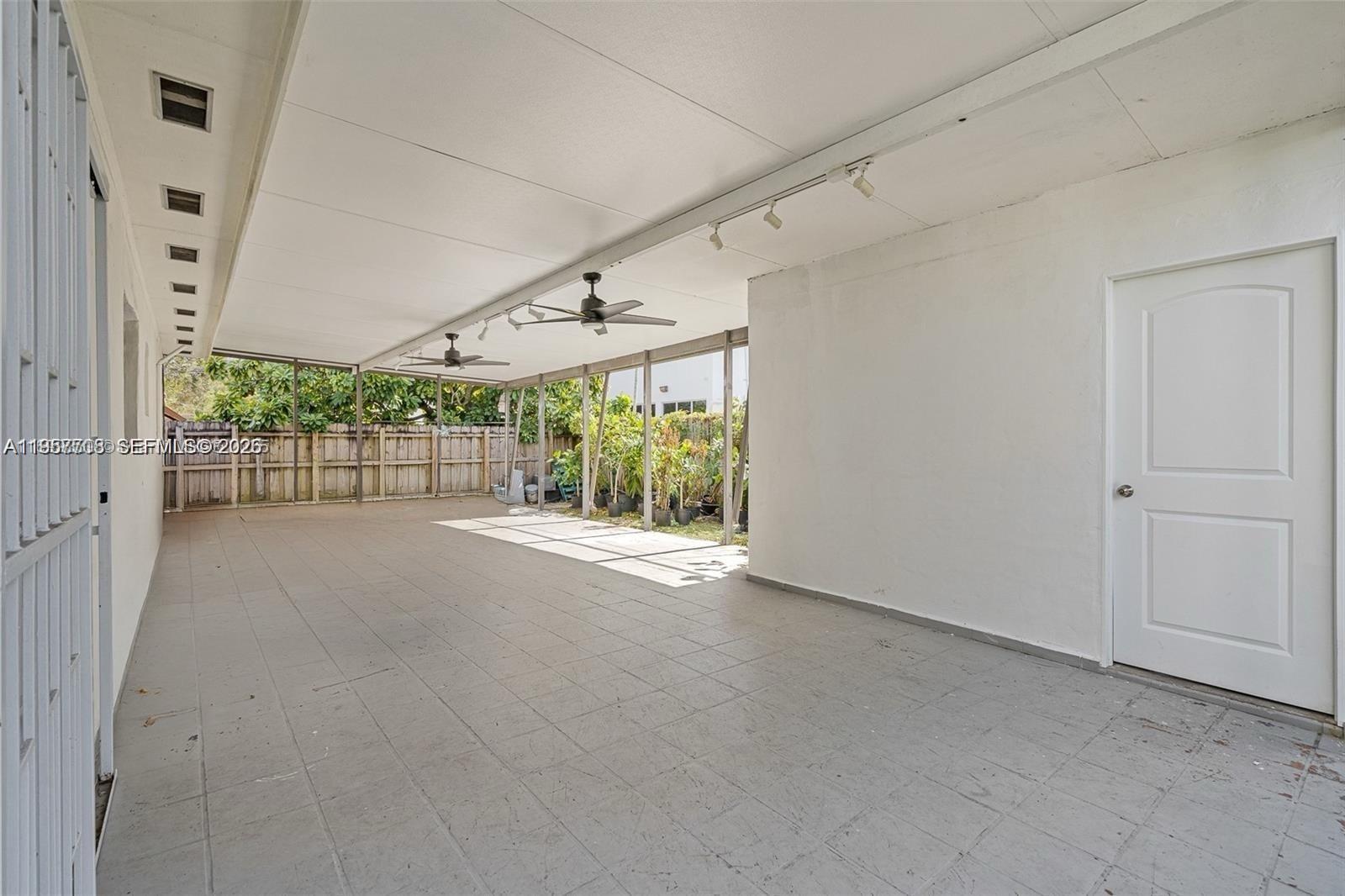 6418 Southwest 39th Terrace Miami, FL 33155 - Photo 22 of 24 en empty room with windows