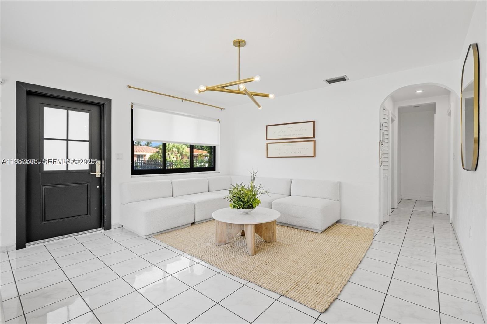 6418 Southwest 39th Terrace Miami, FL 33155 - Photo 4 of 24 a living room with a couch