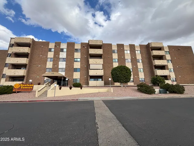 a view of a building with a street