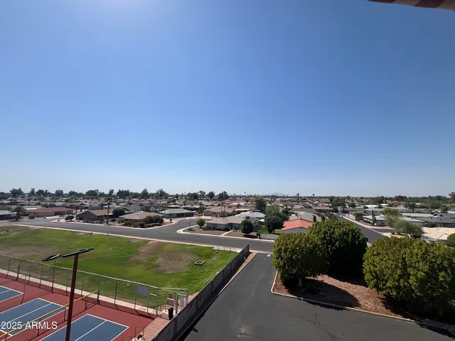 a spacious bathroom with a double vanity sink and a mirror
