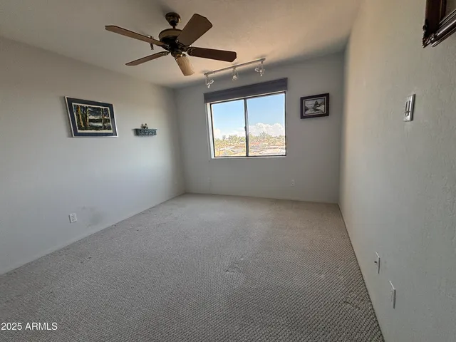 a view of a big room with carpet