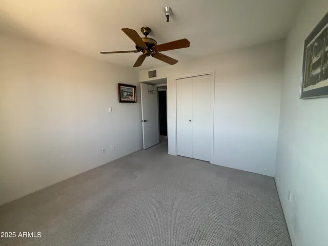 a bedroom with bed and window