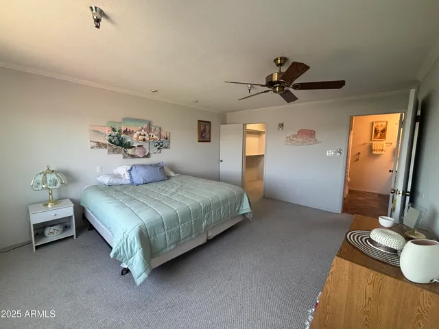 a view of a living room and floor to ceiling window