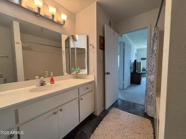 a living room with furniture lamp and window