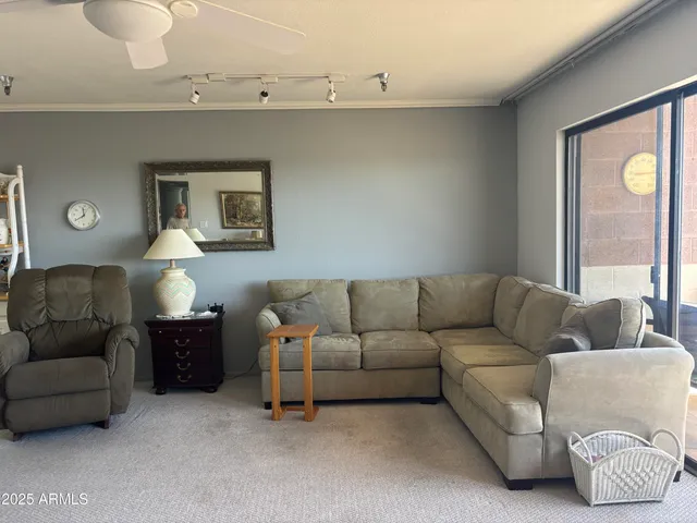 a living room with furniture and a window
