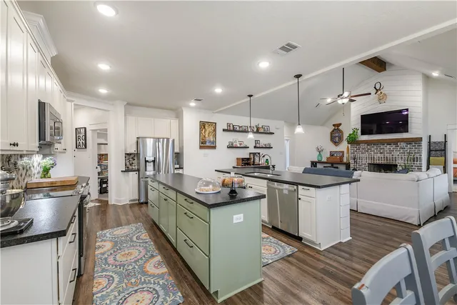 a view of swimming pool with seating area and barbeque oven